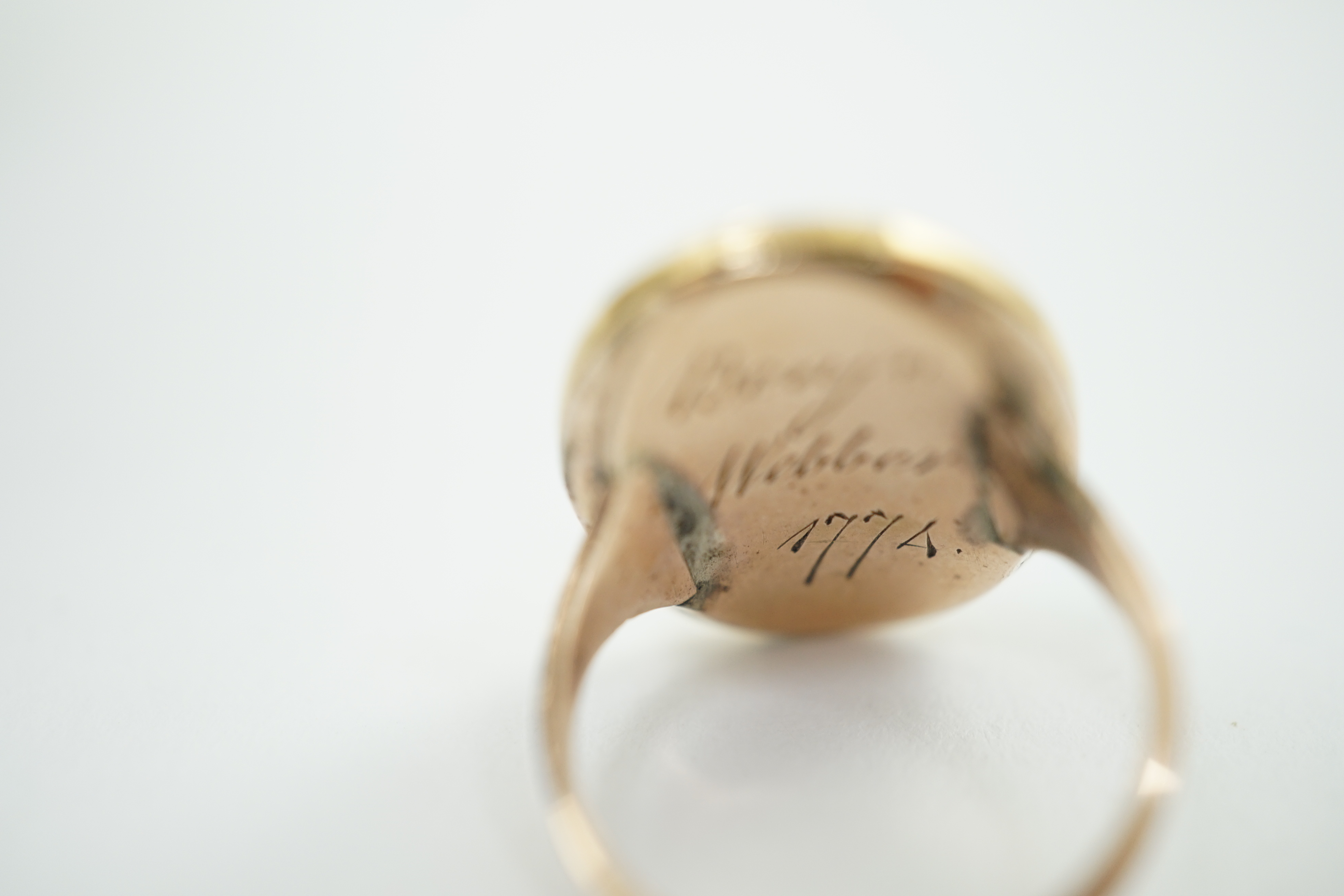 A George III gold memorial ring inset with an ivory miniature of a lady